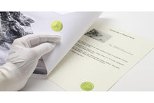 Safeguard the integrity of your artwork with a distinguished hologram certificate of authenticity. Available with Hahnemuhle Baryta Bamboo fine art albums from QTALBUMS.