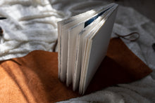 Hahnemuhle Baryta Bamboo fine art album from QTALBUMS with hand-torn, deckled-edge pages in special Journal-style cover.