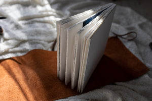 Hahnemuhle Baryta Bamboo fine art album from QTALBUMS with hand-torn, deckled-edge pages in special Journal-style cover.